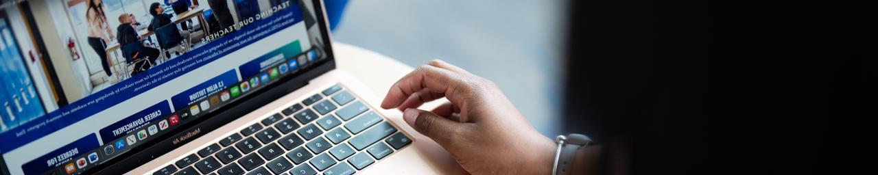 Person using a laptop up close